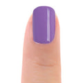 Zoya Delia nail polish bottle showing deep burgundy shade with white cap, positioned on a clean background.