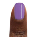 Zoya Delia nail polish bottle with purple and pink shades, featuring a sleek black cap and clear glass container.