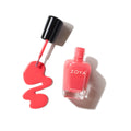Zoya Desi nail polish bottle with vibrant pink color, showcasing the Zoya brand and sleek nail polish packaging.