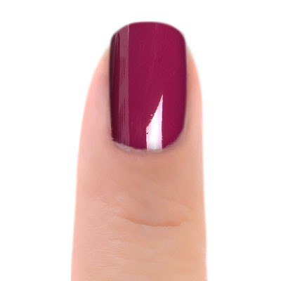 Zoya Donnie nail polish bottle with deep purple shade, featuring a sleek black cap and clear Zoya branding on the label.