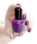 Zoya Evette nail polish bottle with vibrant pink shade and sleek design, showcasing the Zoya brand and product label.