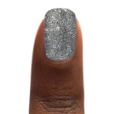Zoya Jett nail polish bottle with clear label, showcasing sleek black cap and vibrant dark gray nail polish color.