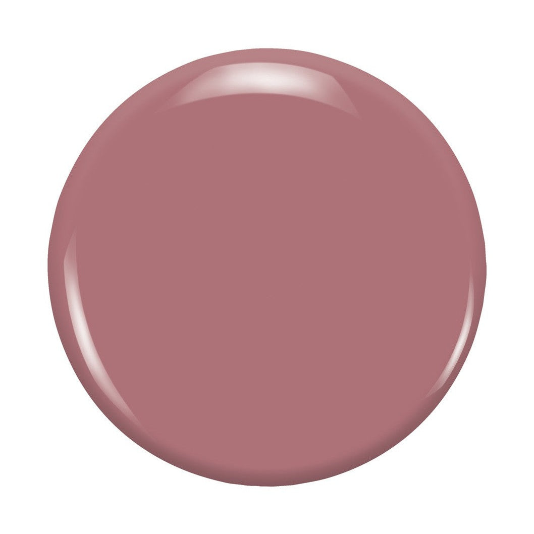 Zoya Madeline nail polish bottle with a deep, elegant shade of pink, featuring a sleek black cap and clear label.