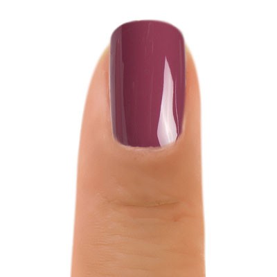 Close-up of Zoya Mai nail polish bottle with vibrant pink color, showcasing the sleek design and branding.