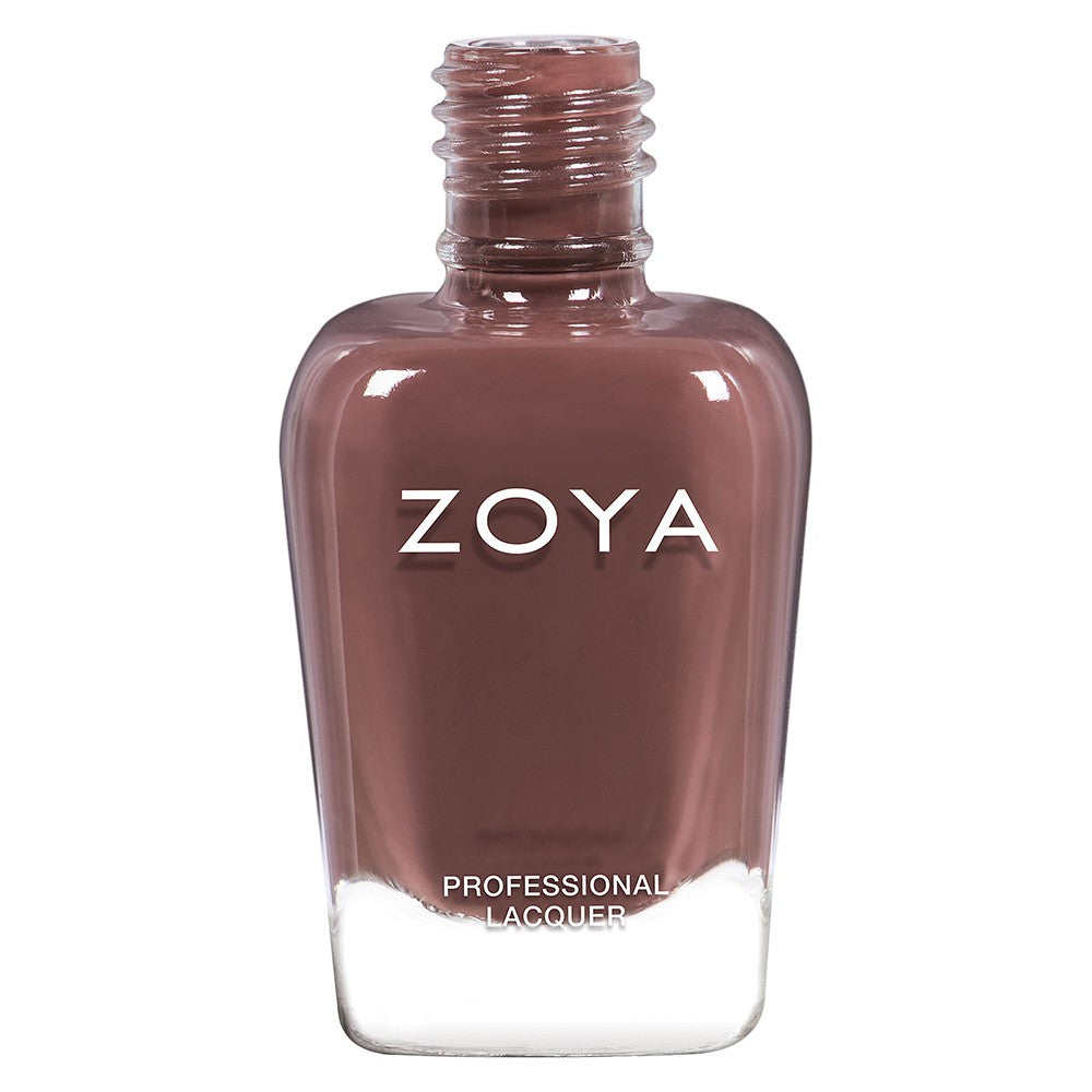 Zoya Mary nail polish bottle with vibrant pink color and sleek Zoya branding, showcasing the nail polish product.
