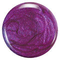 Close-up of Zoya Millie nail polish bottle showing the sleek design and vibrant pink shade.
