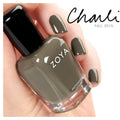 Zoya Charli nail polish bottle with vibrant pink color, showcasing the Zoya brand and sleek packaging on a white background.
