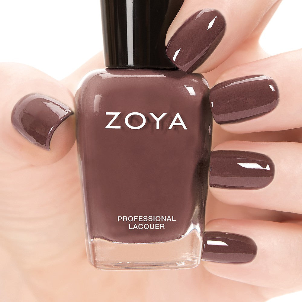 Zoya Mary nail polish bottle with deep plum color and glossy finish, displayed against a neutral background.