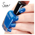 Zoya Sia nail polish bottle with vibrant, shimmering purple shade from Zoya nail polishes collection.