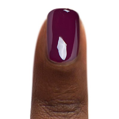 Zoya Tara nail polish bottle with vibrant turquoise shade, showcasing the Zoya brand name on the label.