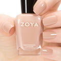 Zoya Tatum nail polish bottle showing deep burgundy color with a sleek black cap.