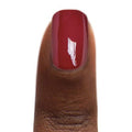 Zoya Yvonne nail polish bottle with colorful swatches on a white background, showcasing the vibrant nail color.